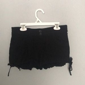 black stretchy shorts with ties on bottom